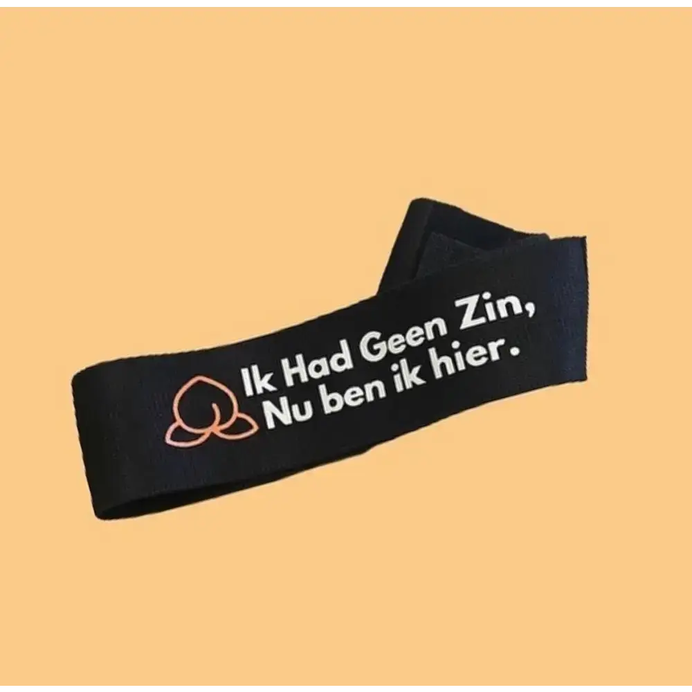 Zwarte verstelbare booty band met oranje design en armband met tekst voor workouts